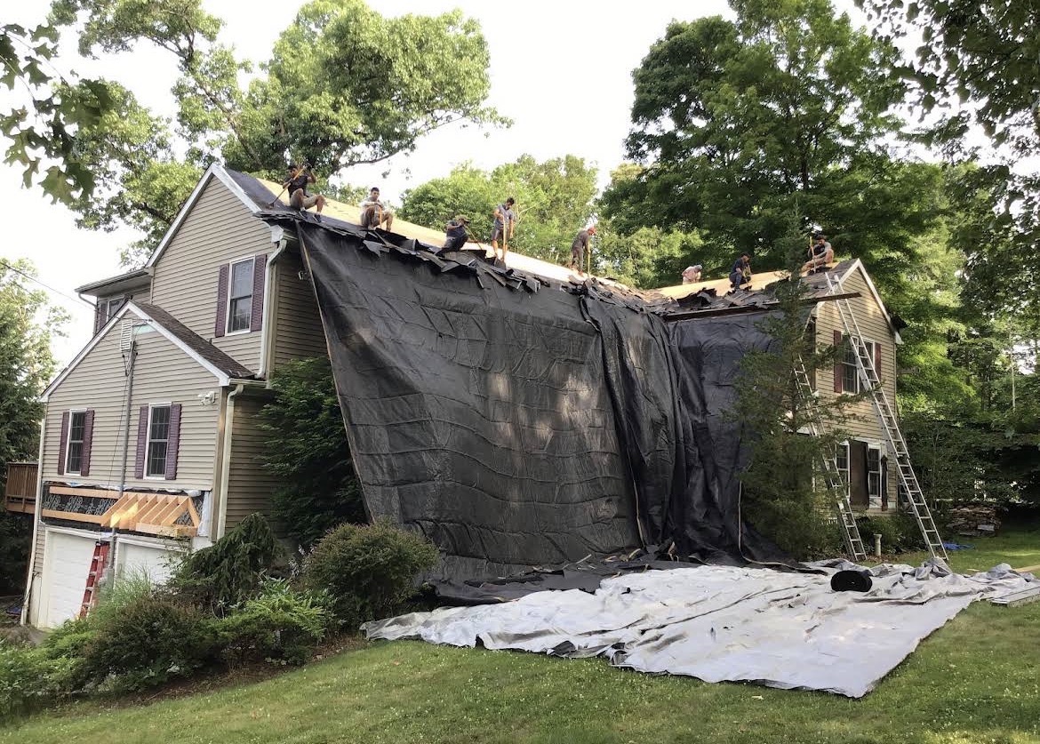 Roof tear-off in progress with property protection on a Brookfield Connecticut home before GAF Timberline shingles were installed